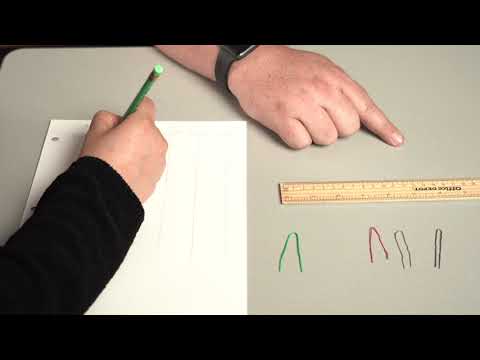 Two hands, ruler and pencil with paper