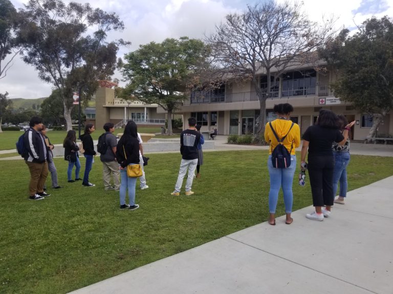 Teenagers are standing near a student health center