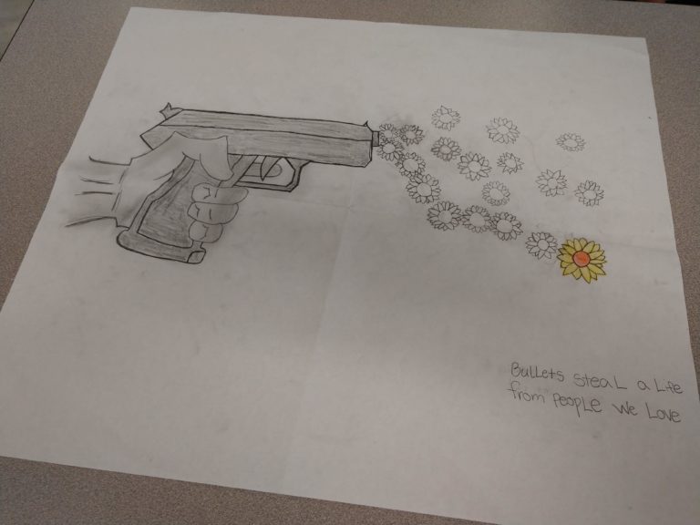 Piece of paper with an illustration with the gun and flowers