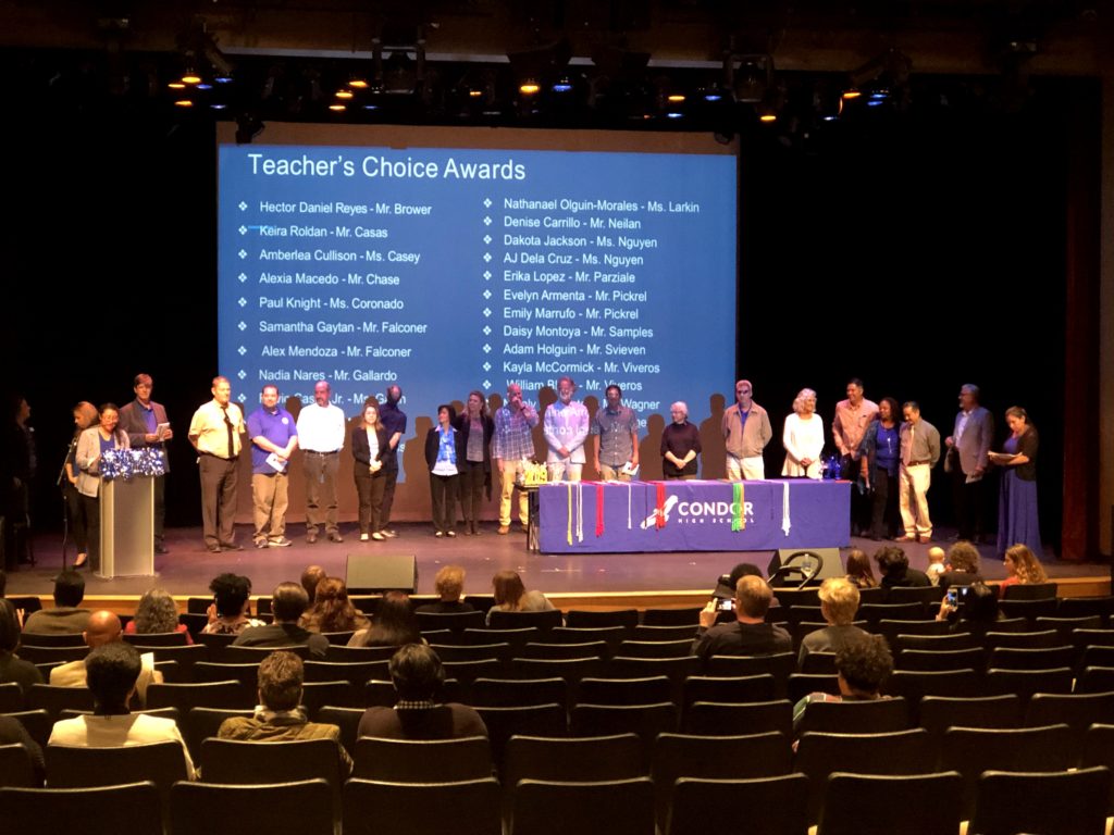 People are standing in the hall of Teacher's Choice Awards