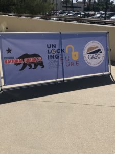Banner of California national guard is standing on the street