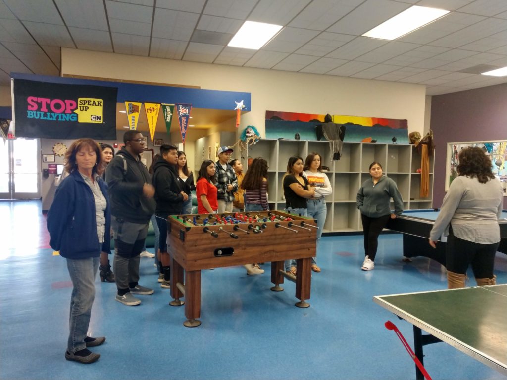 People standing in the game room