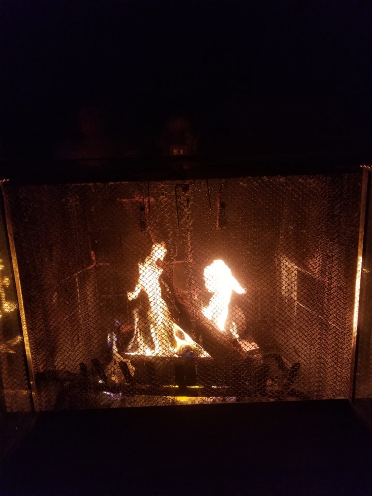 Burning fireplace in the night