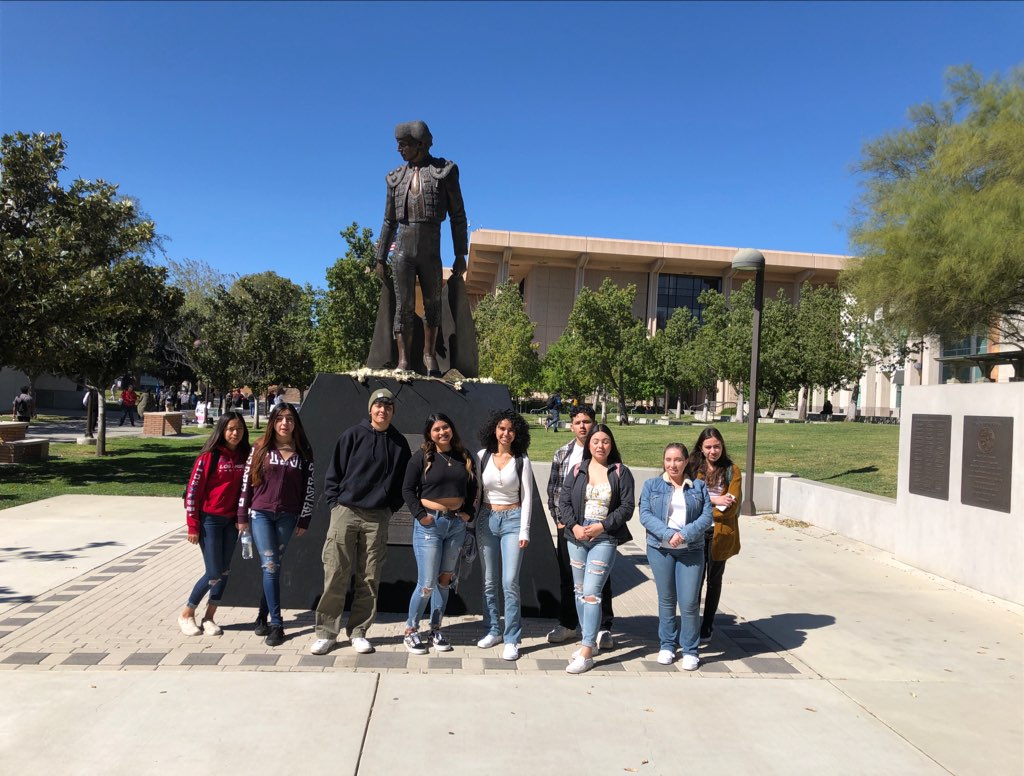 Students in front of statue